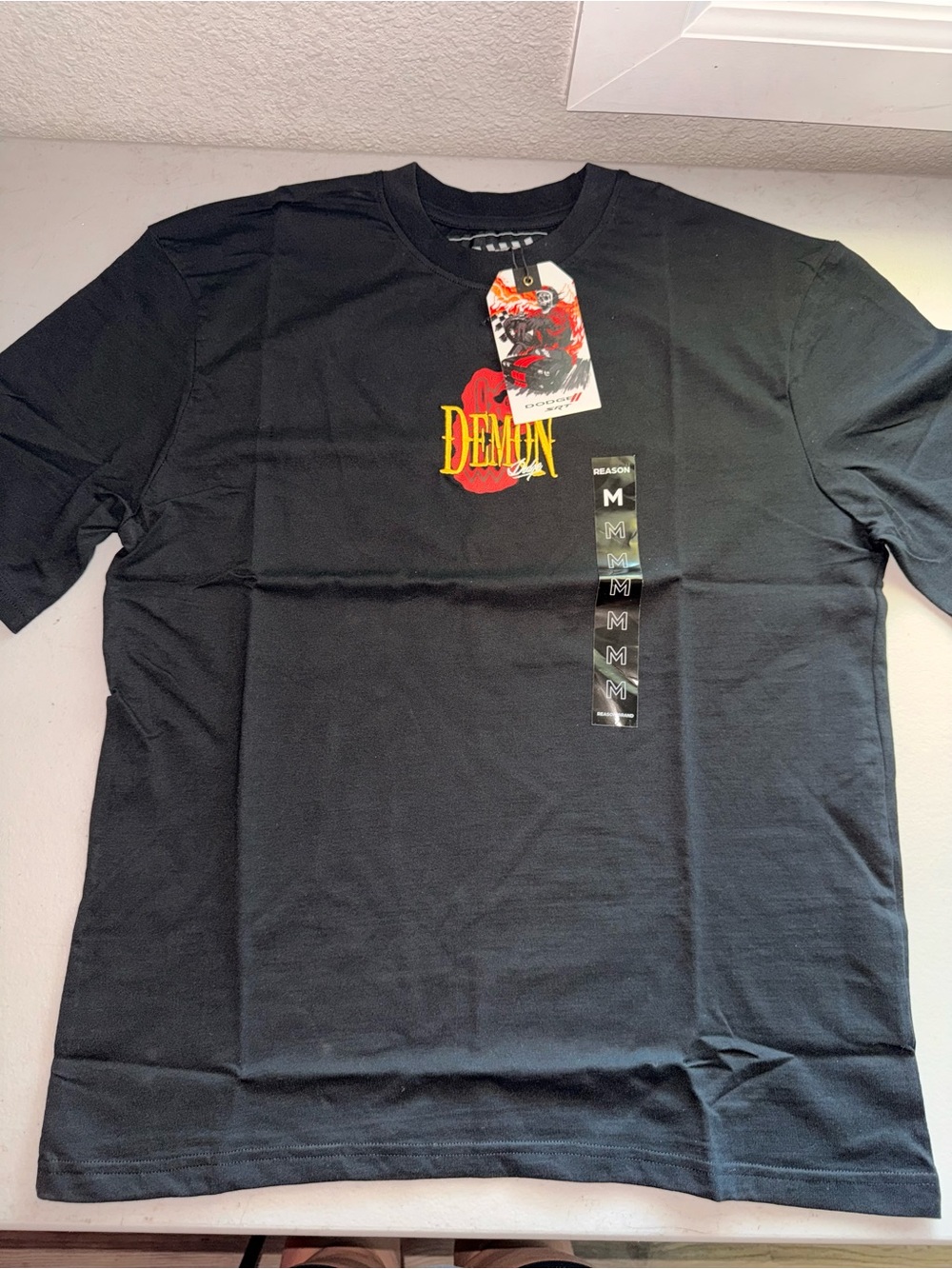 Reason 'Demon' Black Short Sleeve Tee with Red and Yellow Graphic